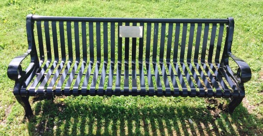 Image of a black 6' steel park memorial bench.
