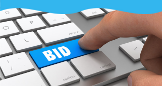 photo of a keyboard with the word bid in blue