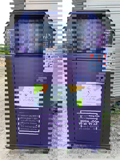 Photo of purple textile recycling bin