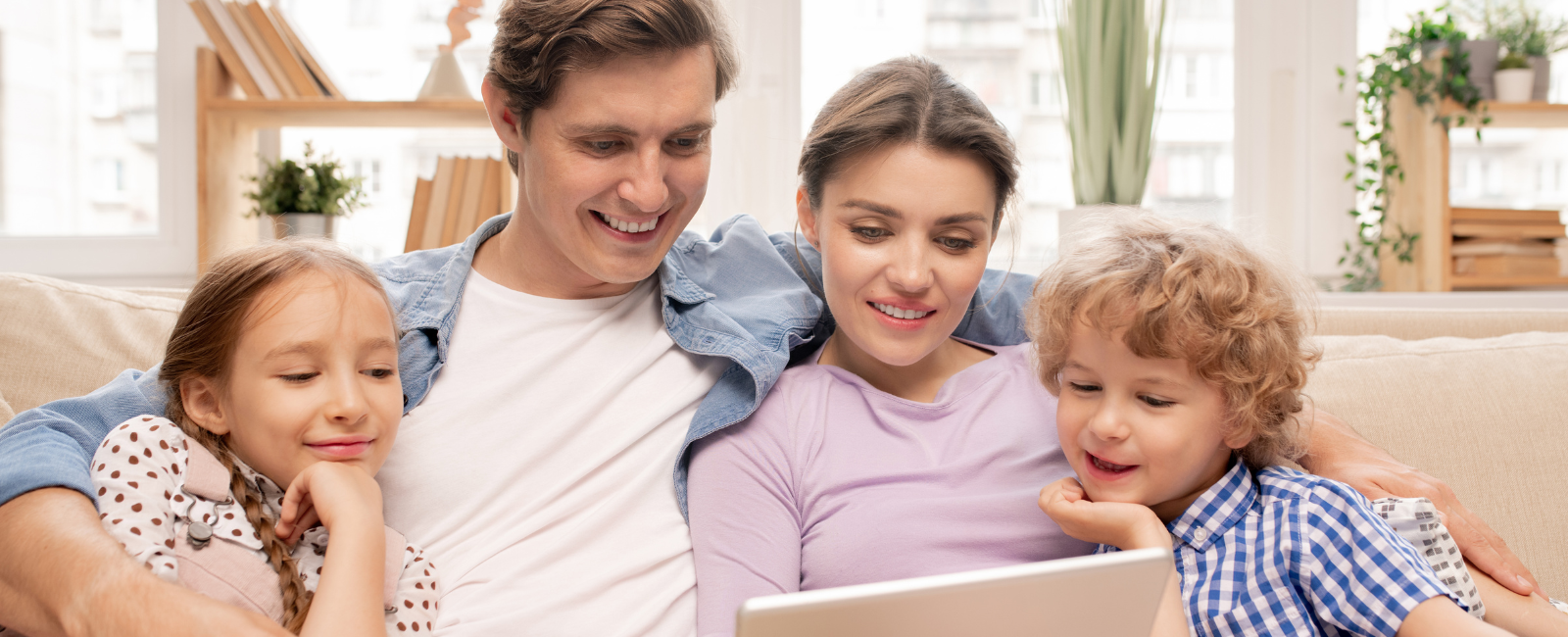 A family of four plays the Waste Sorting Game on a tablet